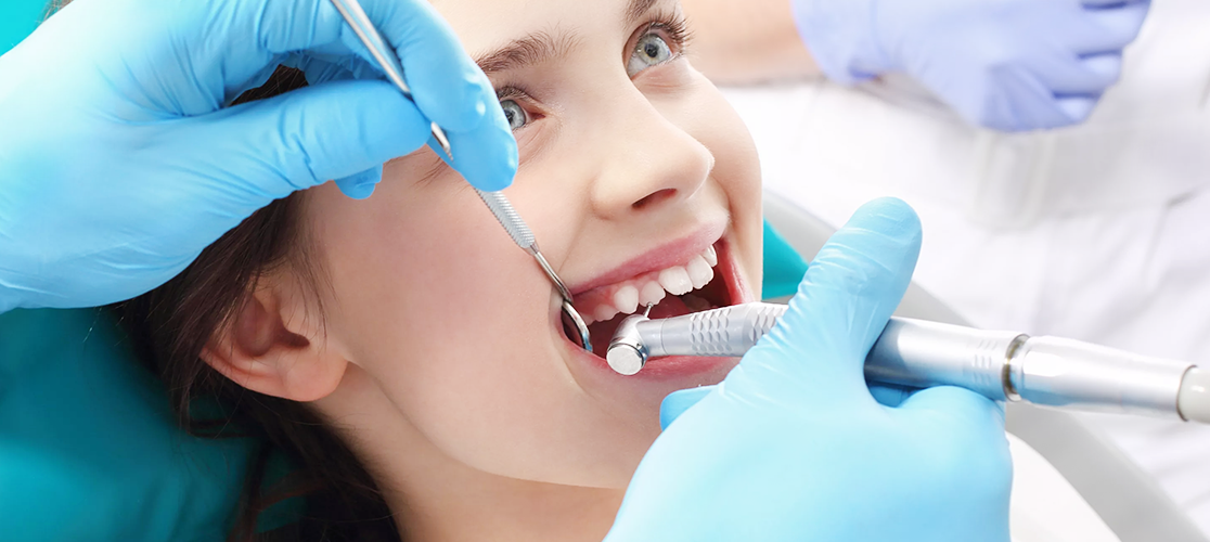 Endodontist treats woman with root canal procedure at modern dental clinic in Panchavati